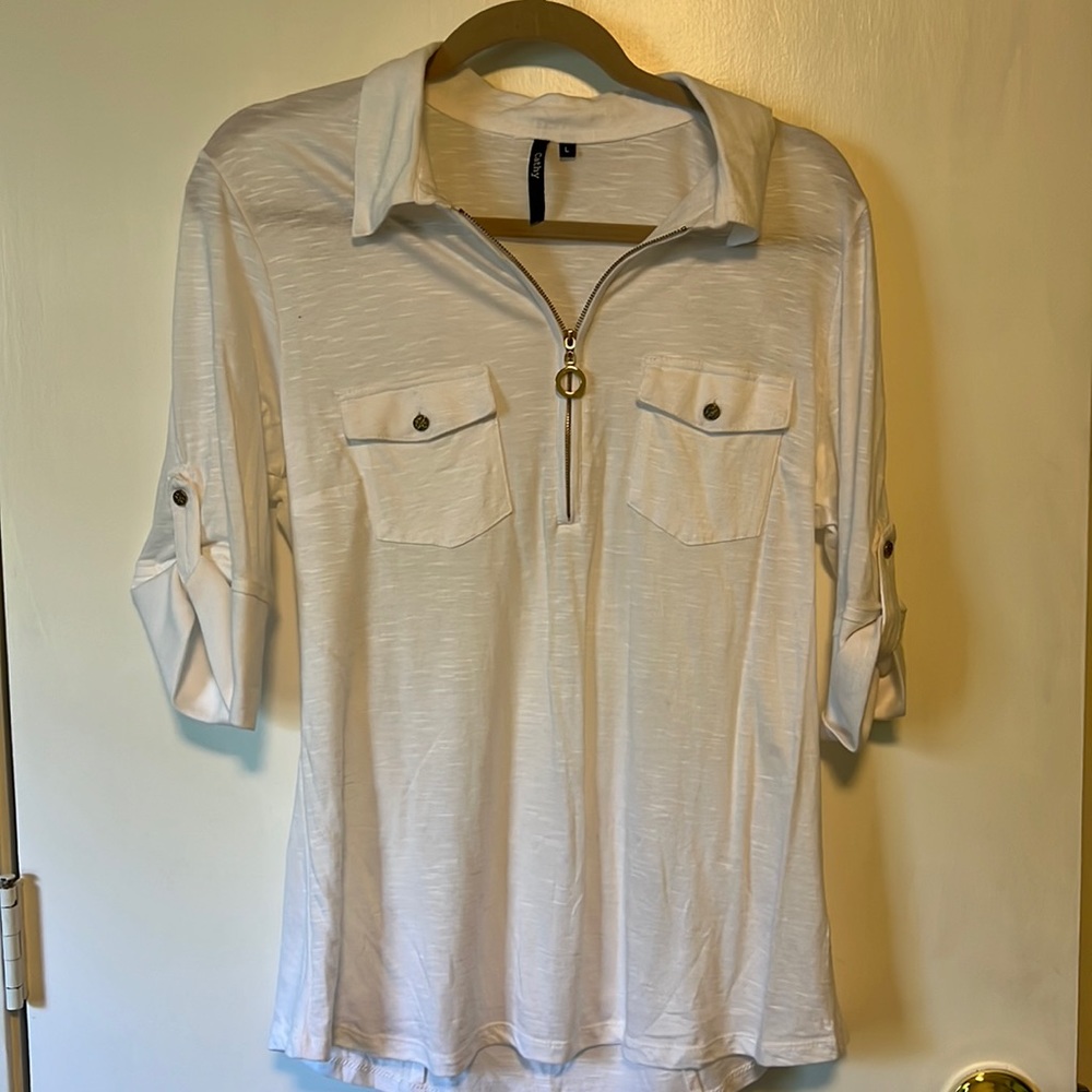 Very cute white top with zipper in front and buttoned sleeves, in a large.